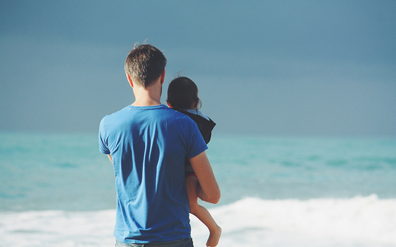 father and daughter on a beach