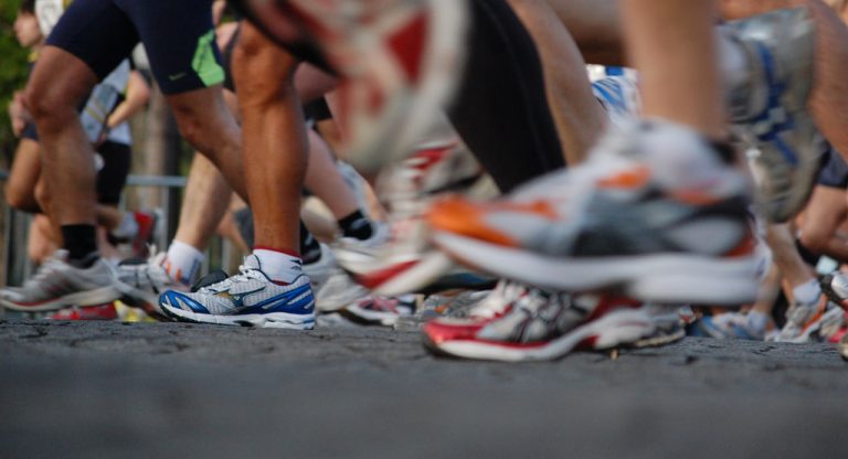 Photo: People at the starting line of a race.